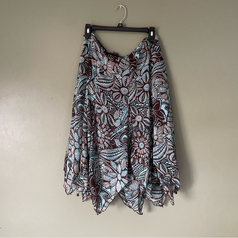 Brown and blue floral print midi skirt with a flowy, wispy design